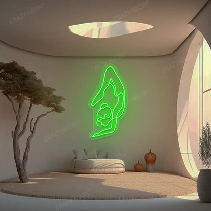 Purna Vrishchikasana Yoga Neon Sign glowing in green color in a yoga room