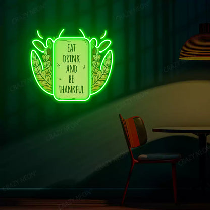 Eat drink and be thankful neon sign in green