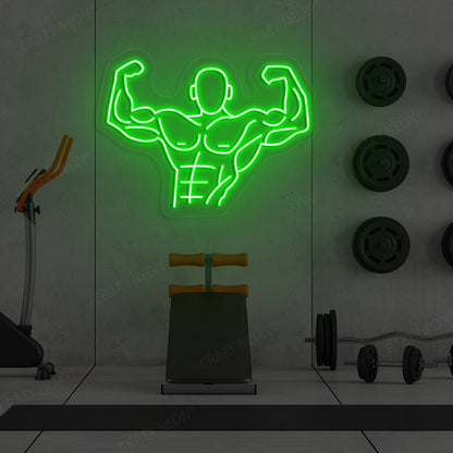 green flexing bodybuilder gym neon sign mounted on a wall