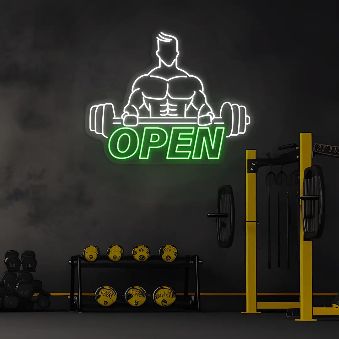 green and white open gym bodybuilder neon sign mounted on a wall