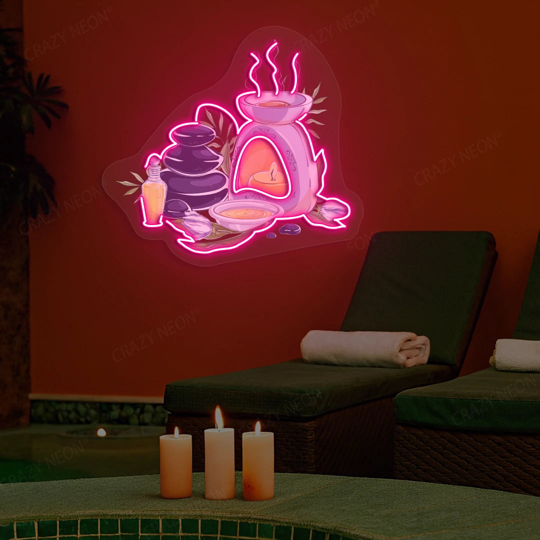 Spa Stones & Aromatherapy Neon Artwork lighting up in pink color on a spa wall