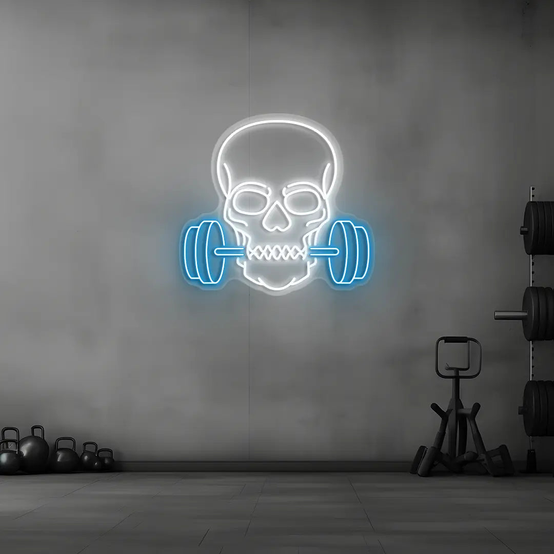 ice blue and white skull barbell gym neon sign mounted on a wall