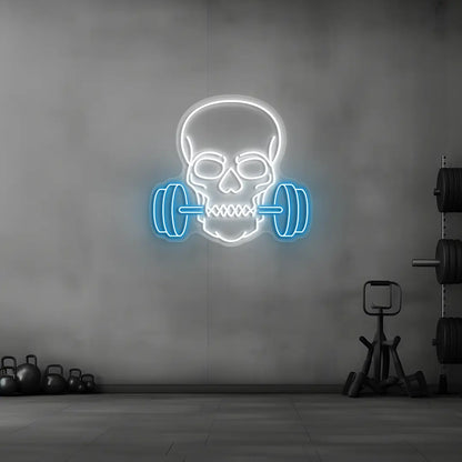 ice blue and white skull barbell gym neon sign mounted on a wall
