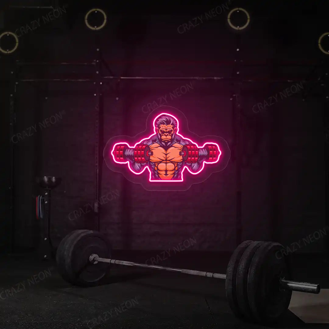 pink monkey workout gym neon artwork mounted on a wall