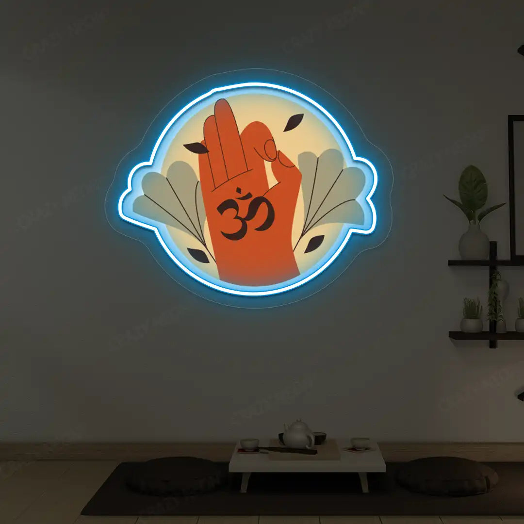 Om Gyan Mudra Neon Artwork lighting up in iceblue color in a yoga room