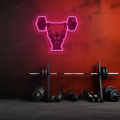 pink barbell overhead press gym neon artwork mounted on a wall 