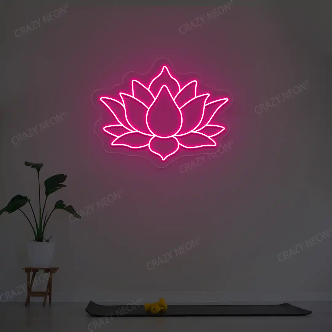 Lotus Flower Neon Sign lighting up in pink color in a yoga room