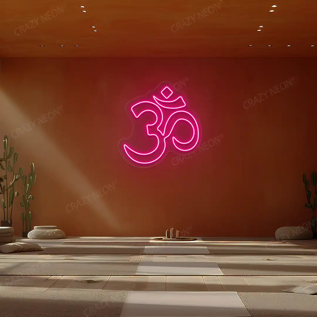 Om Symbol Neon Sign lighting up in pink color in a yoga room