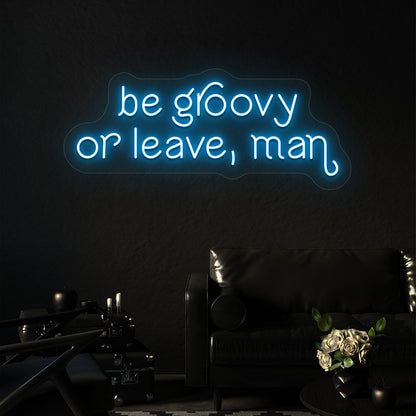 ice blue be groovy or leave, man vintage neon sign mounted on a wall