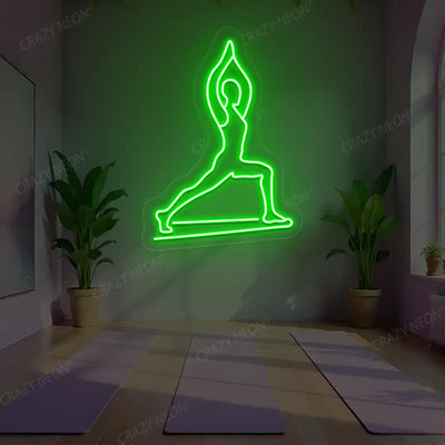 Virabhadrasana I Yoga Neon Sign lighting up in green color in a yoga room