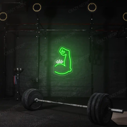 green and white bicep pump neon sign mounted on a wall