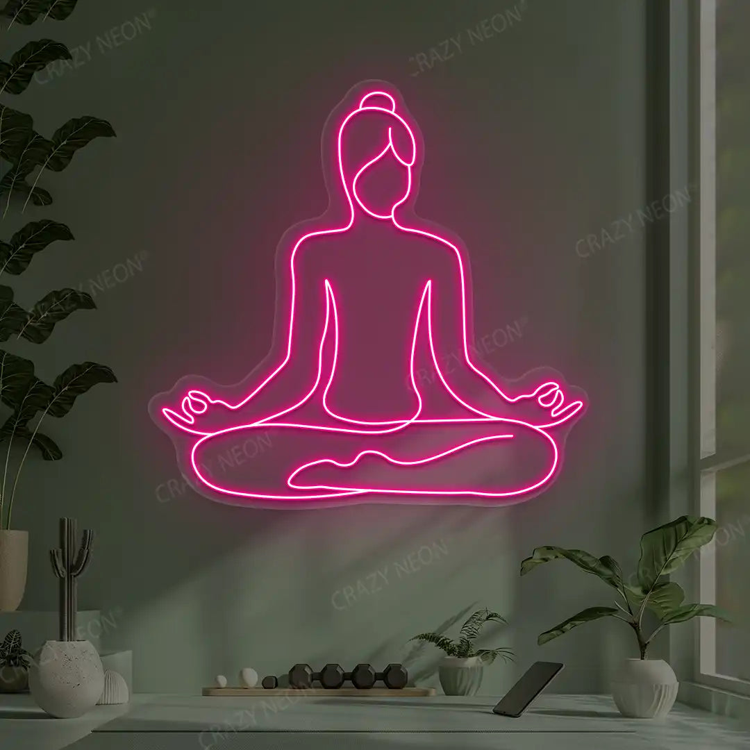 Swastikasana Contour Yoga Neon Sign lighting up in pink color in a yoga room