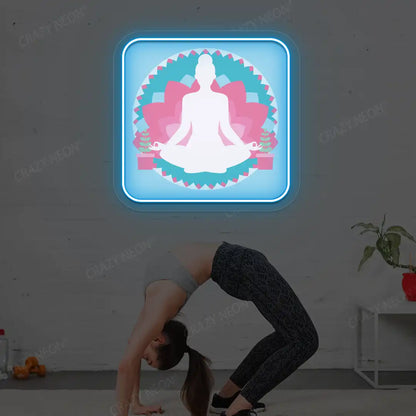 Padmasana Mandala Yoga Neon Artwork lighting up in iceblue color in a yoga room