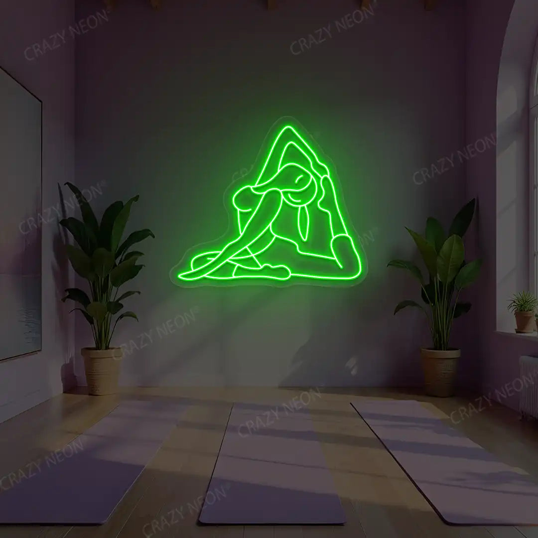 Eka Pada Rajakapotasana Yoga Neon Sign lighting up in green color in a yoga room