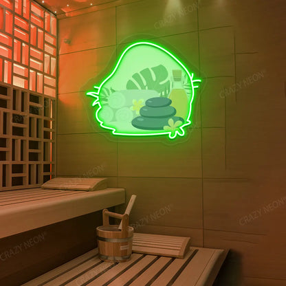 Spa Stones & Serenity Neon Artwork lighting up in green color on a wooden wall