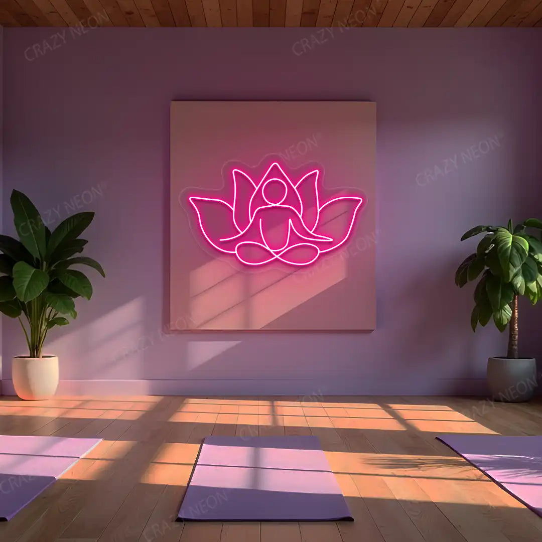 Lotus Meditation Neon Sign lighting up in pink color in a yoga room