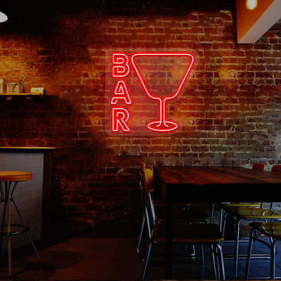 red glass and bar neon sign mounted on a wall