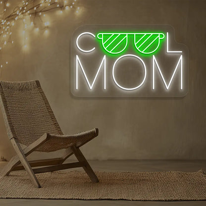 green and white cool mom trendsetter neon sign mounted on a wall