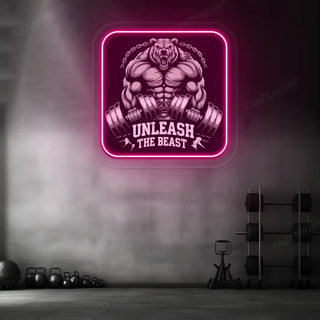 pink unleash the beast bear neon artwork mounted on a wall