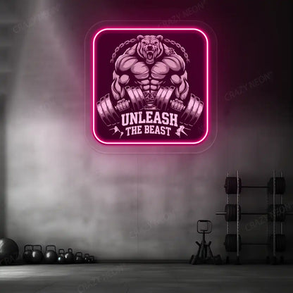 pink unleash the beast bear neon artwork mounted on a wall