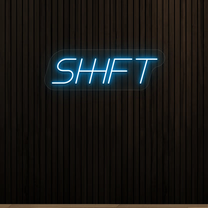 ice blue shift vintage neon sign mounted on a wall