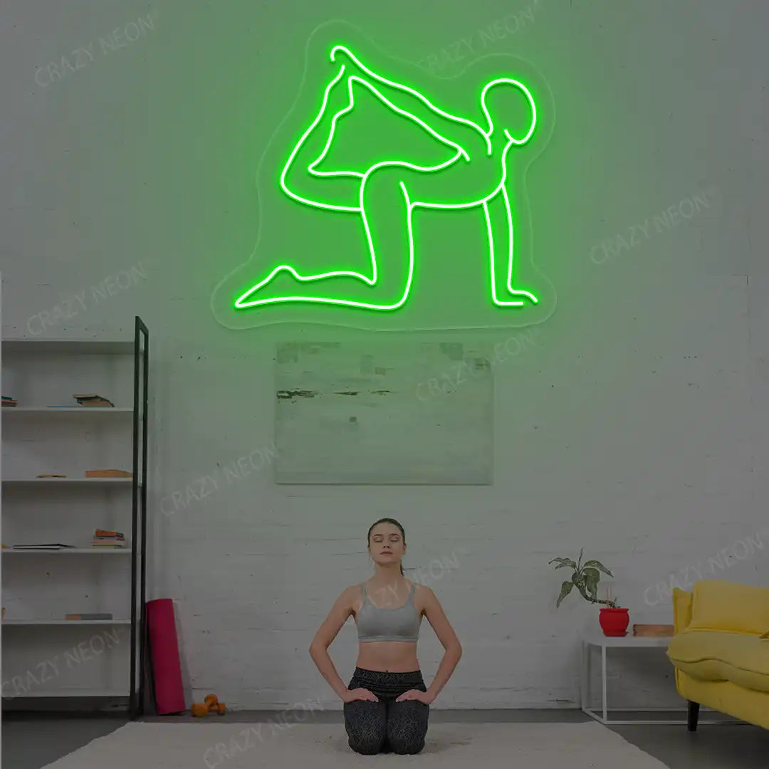 Eka Hasta Vyaghrasana Yoga Neon Sign glowing in green color in a yoga room