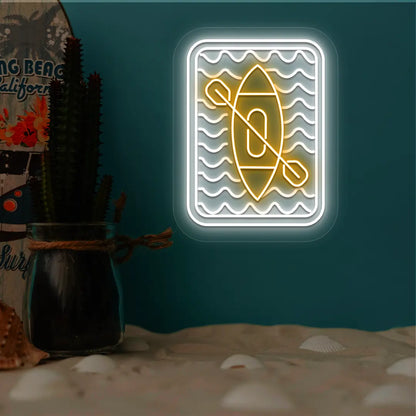 orange and white kayak ocean waves neon sign mounted on a wall
