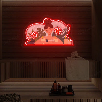 Aromatherapy Relaxation Neon Artwork lighting up in red color on a wooden spa wall