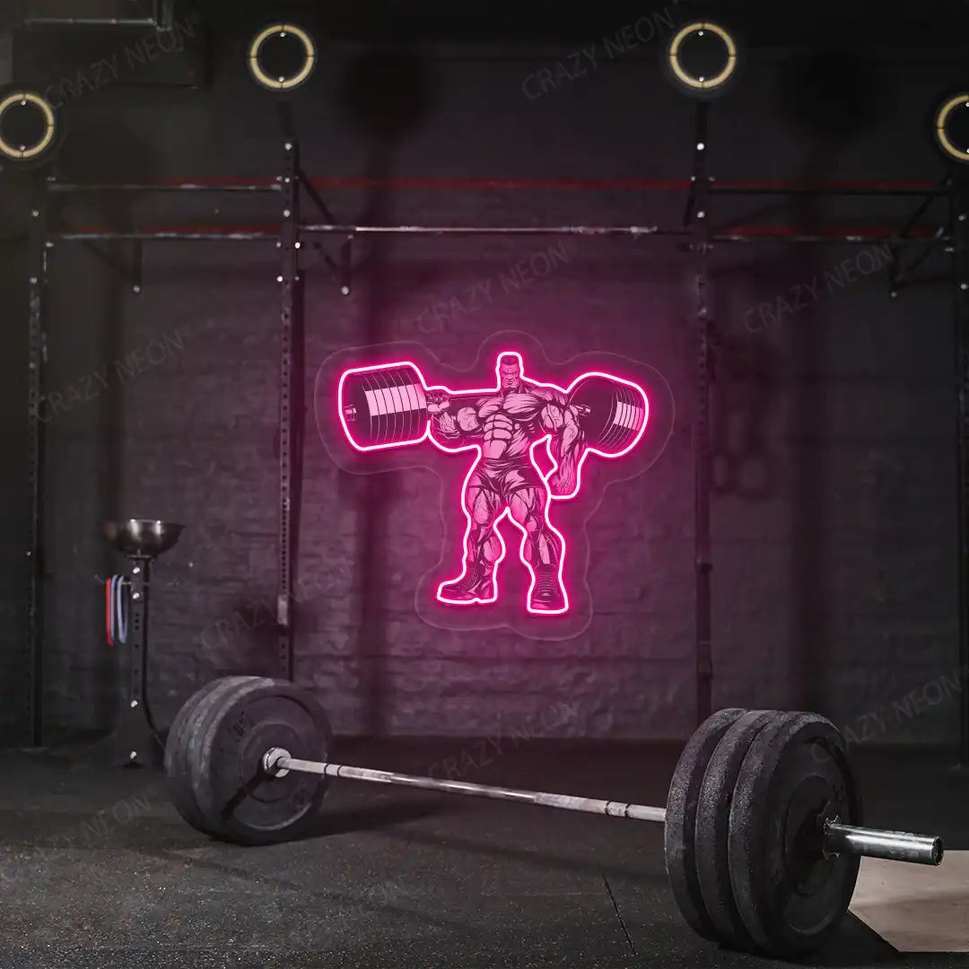 pink bodybuilder power flex gym neon artwork mounted on a wall