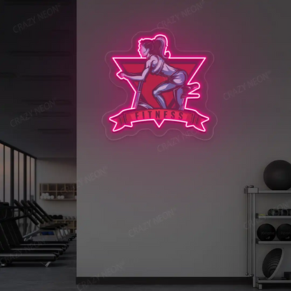 pink girl spinning fitness neon artwork mounted on a wall