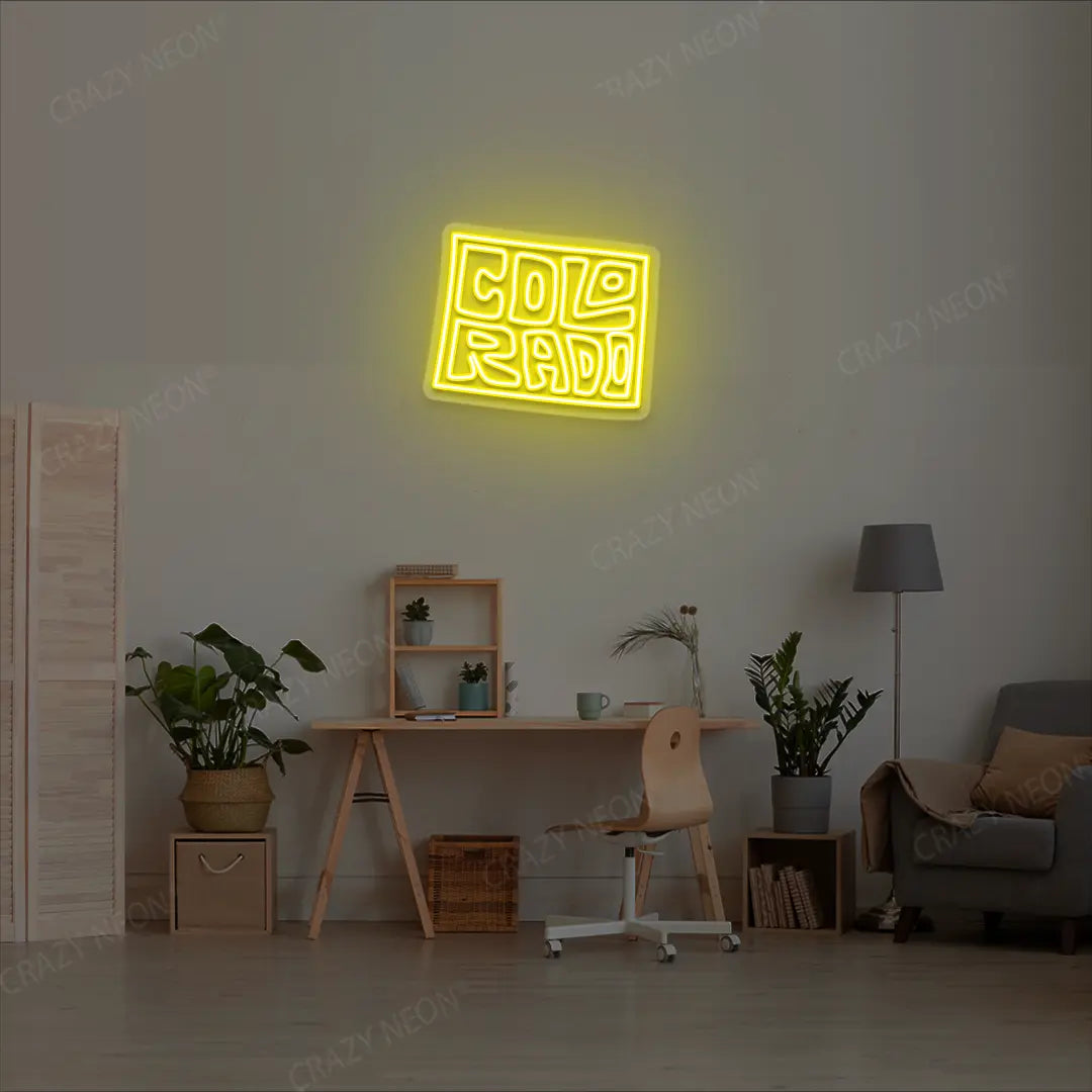 COLORADO Map Neon Sign lighting up in yellow color in a room