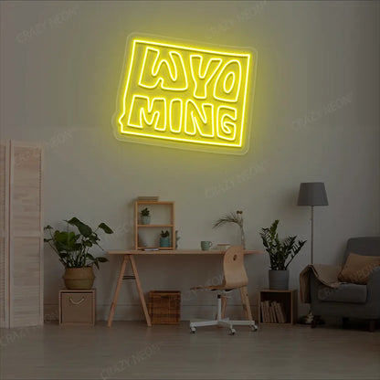 WYOMING Map Neon Sign lighting up in yellow color in a room