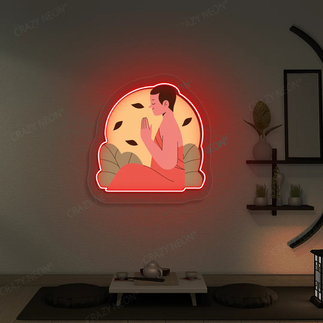 Serene Monk Neon Artwork lighting up in red color in a yoga room