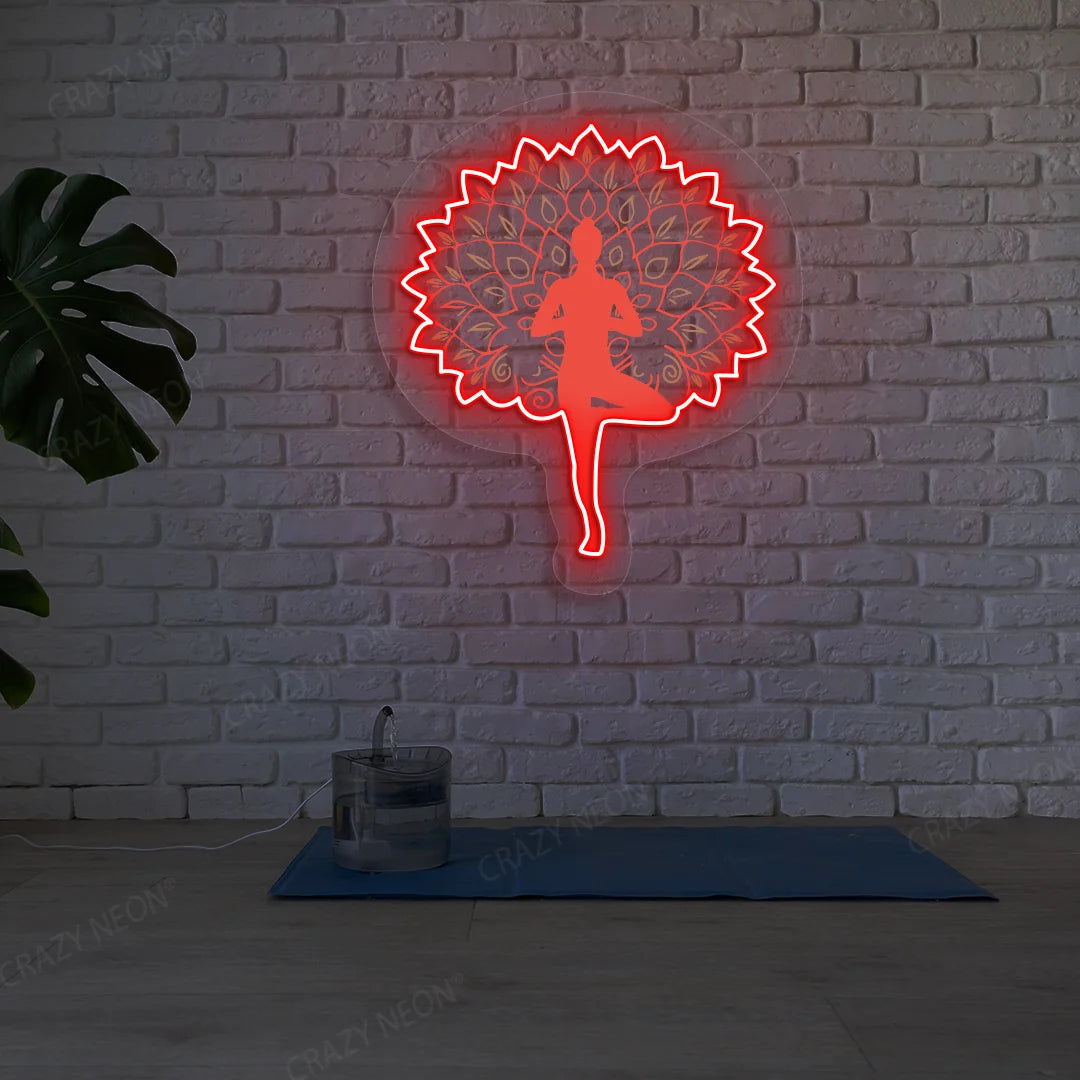 Mandala Yogi Harmony Tree Pose Yoga Neon Artwork lighting up in red color in a yoga room