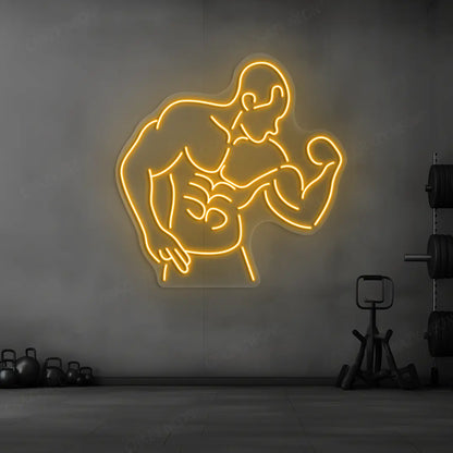 orange muscle man flex neon sign mounted on a wall