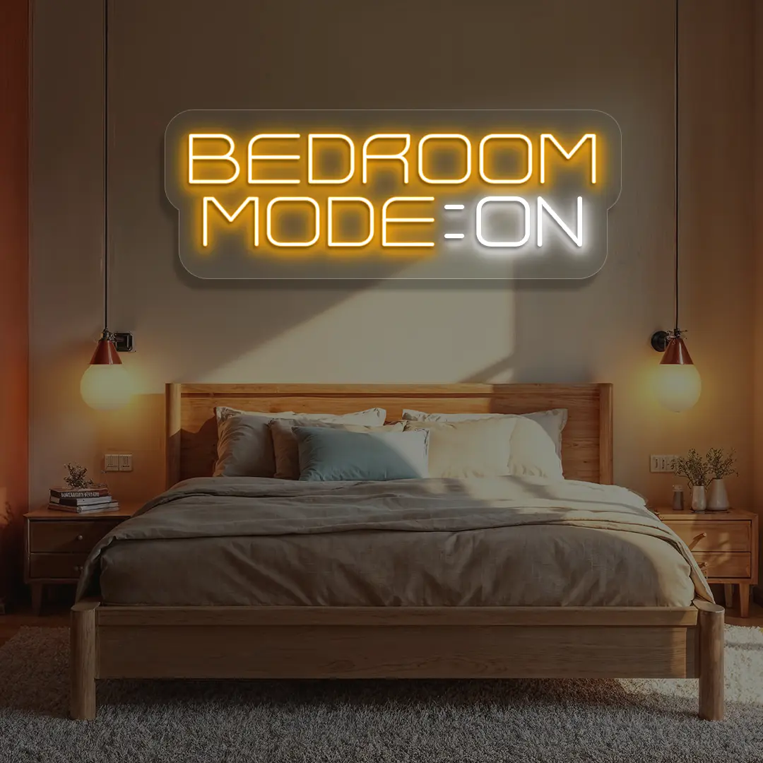 orange and white bedroom mode on neon sign mounted on a wall