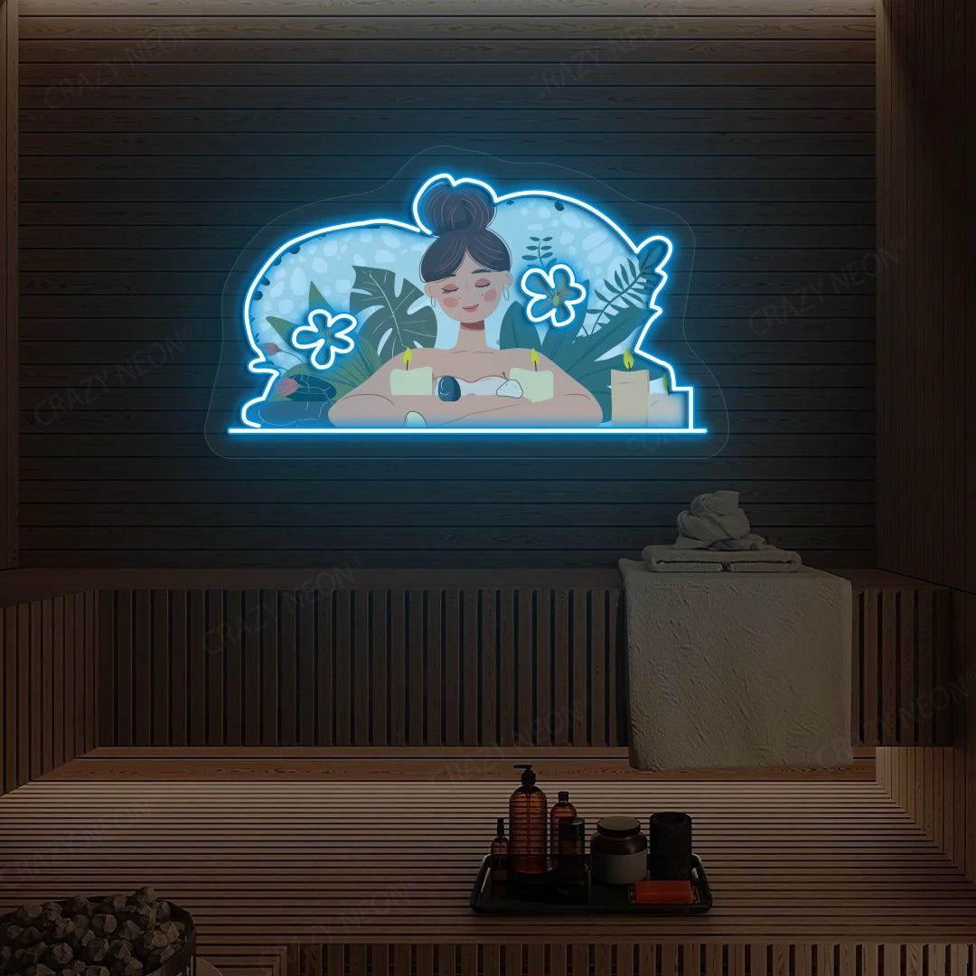 Aromatherapy Relaxation Neon Artwork lighting up in ice blue color on a wooden spa wall