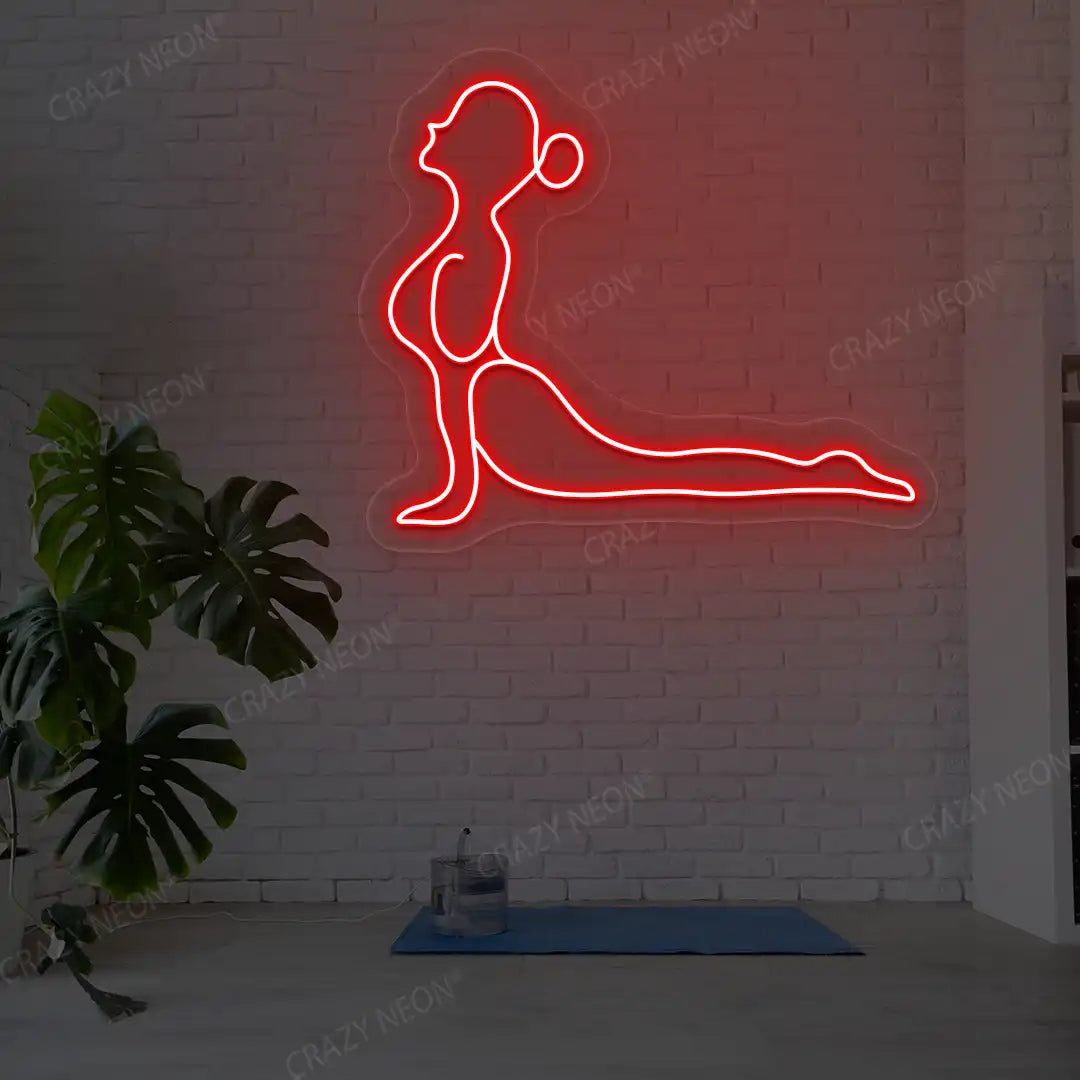 Bhujangasana Yoga Neon Sign glowing in red color in a yoga room