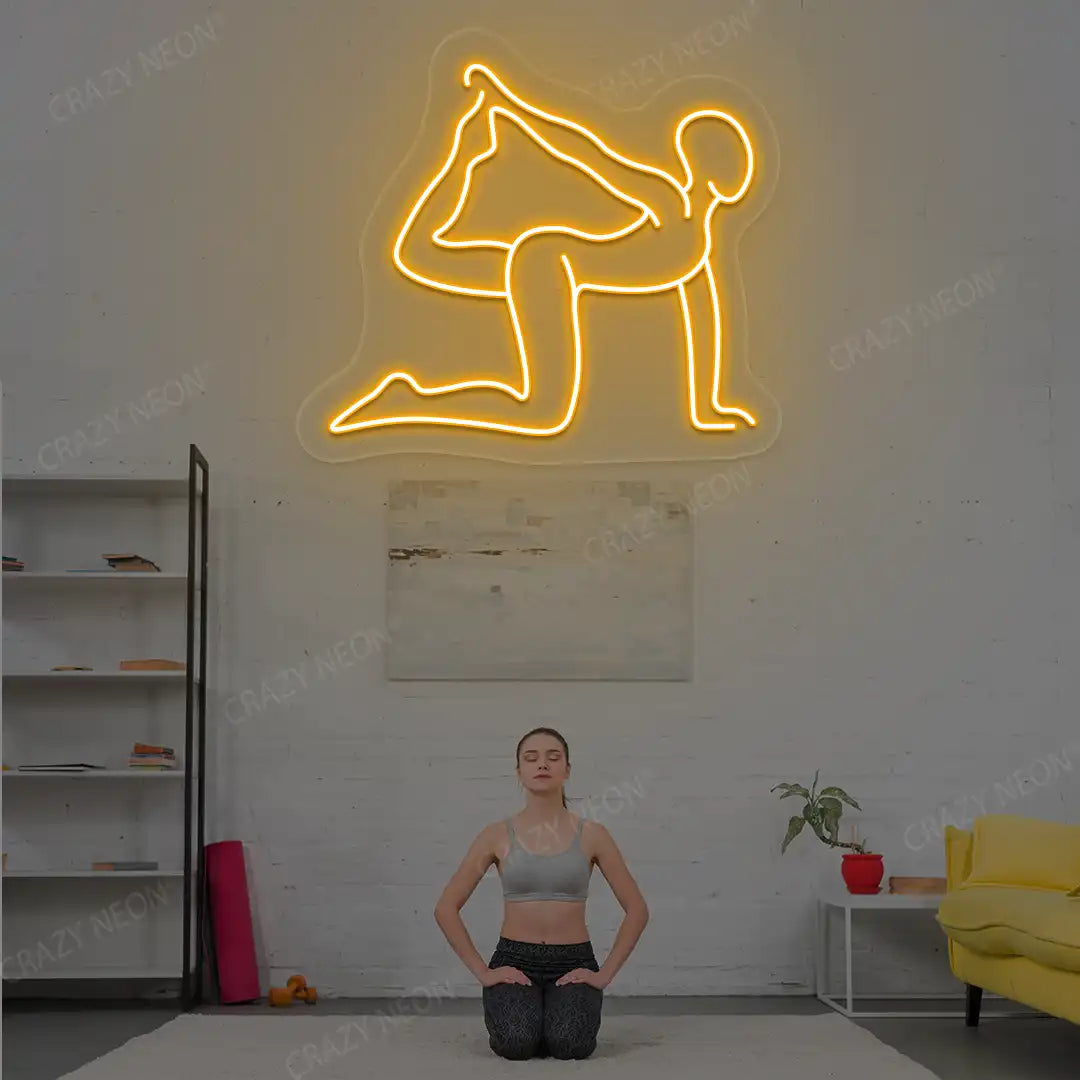 Eka Hasta Vyaghrasana Yoga Neon Sign glowing in orange color in a yoga room