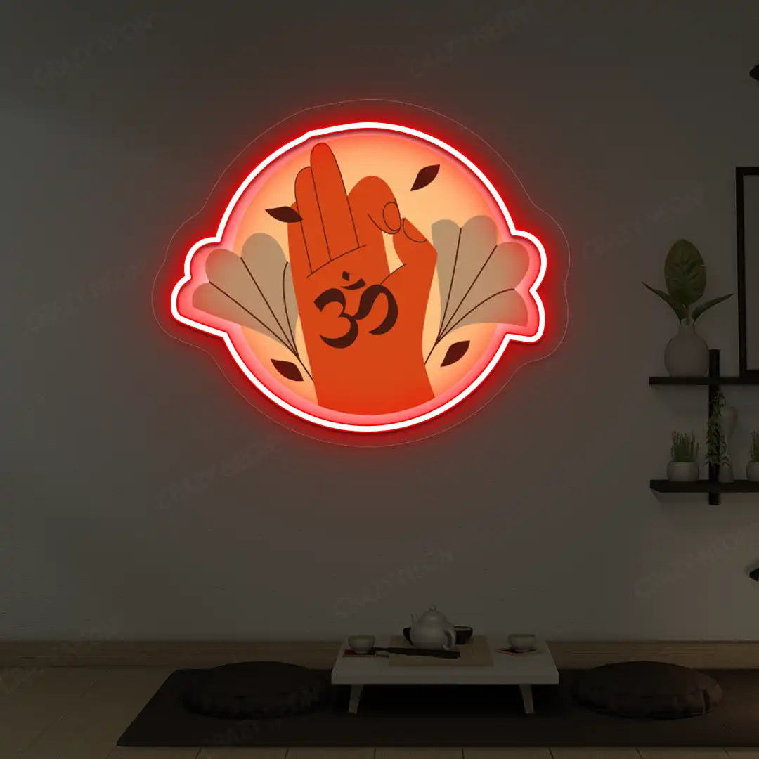 Om Gyan Mudra Neon Artwork lighting up in red color in a yoga room