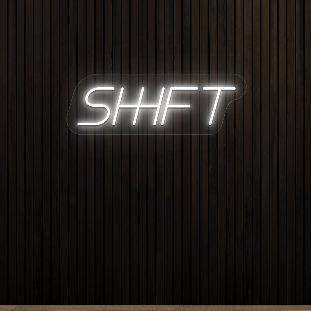 white shift vintage neon sign mounted on a wall