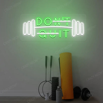 green and white don’t quit do it neon sign mounted on a wall