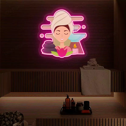 Steam Wellness Neon Artwork lighting up in pink color on a wooden spa wall