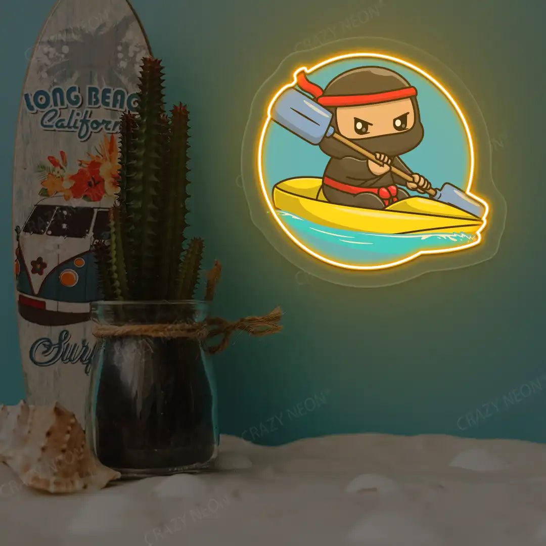 orange ninja kayaking neon artwork mounted on a wall