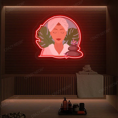 Zen Facial Spa Neon Artwork lighting up in red color on a wooden spa wall