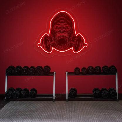 red gorilla barbell gym neon artwork mounted on a wall