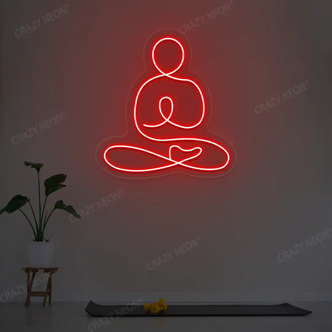 Swastikasana Yoga Neon Sign lighting up in red color in a yoga room
