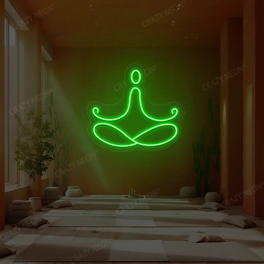 Padmasana Yoga Neon Sign lighting up in green color in a yoga room