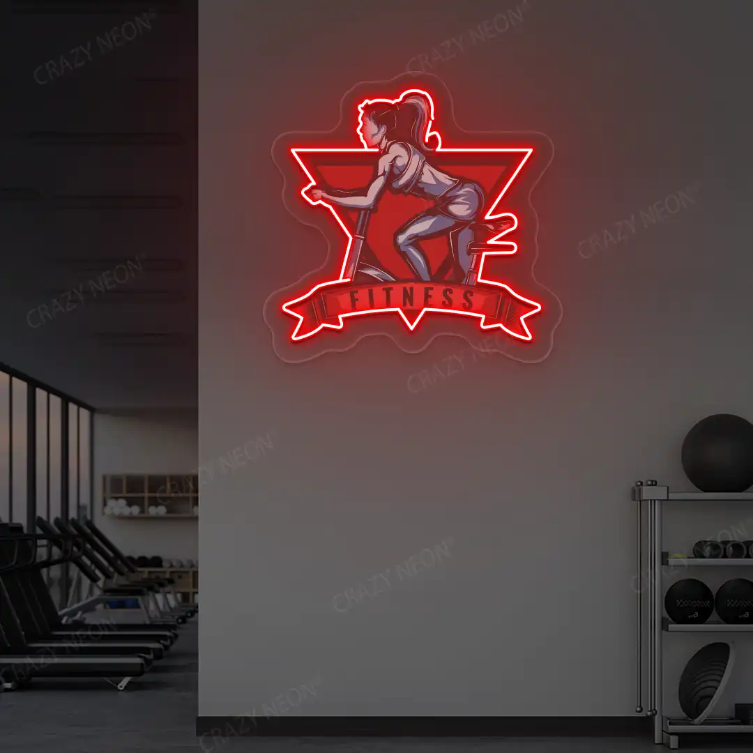 red girl spinning fitness neon artwork mounted on a wall