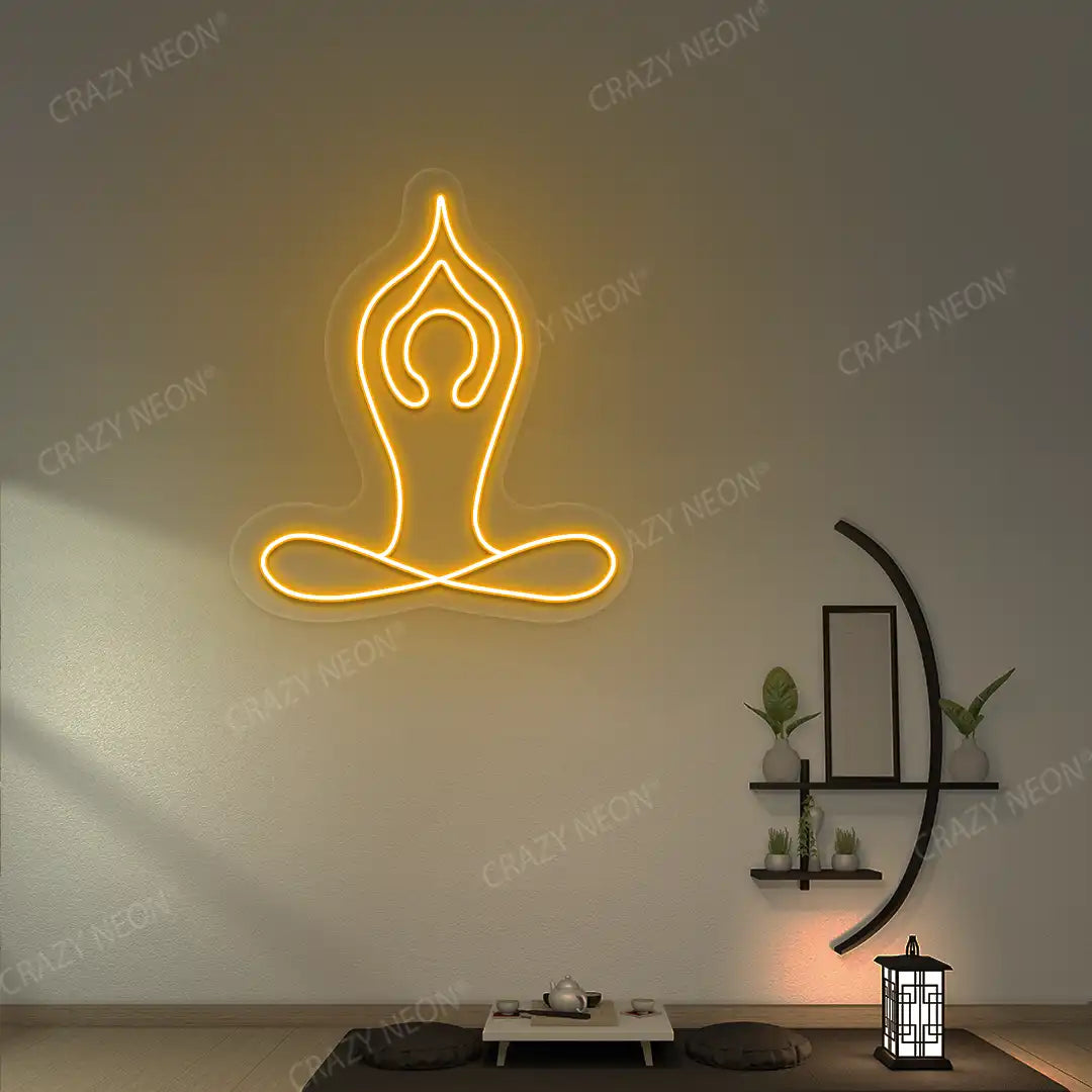 Padmasana With Raised Arms Yoga Neon Sign lighting up in orange color in a yoga room